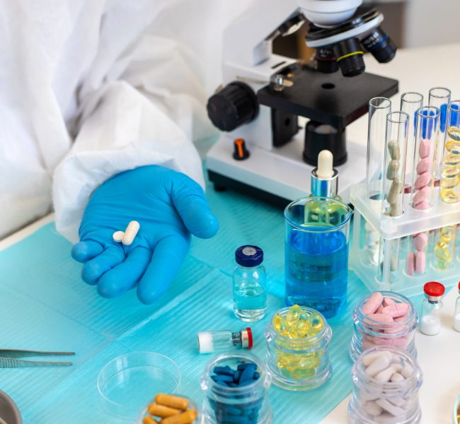 examine drugs in the laboratory. Selective focus. pills.